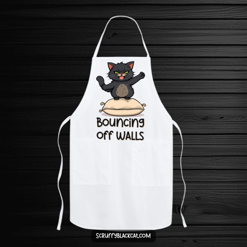 Funny Apron: Scruffy black cat with a mischievous grin leaping acrobatically over a cushion, ready for kitchen antics.