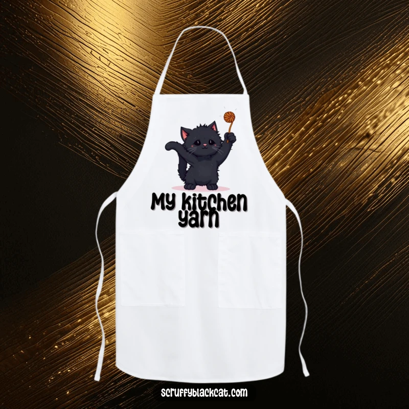 Funny kitten apron with a scruffy black kitten playing with a yarn ball, perfect for a playful baker.