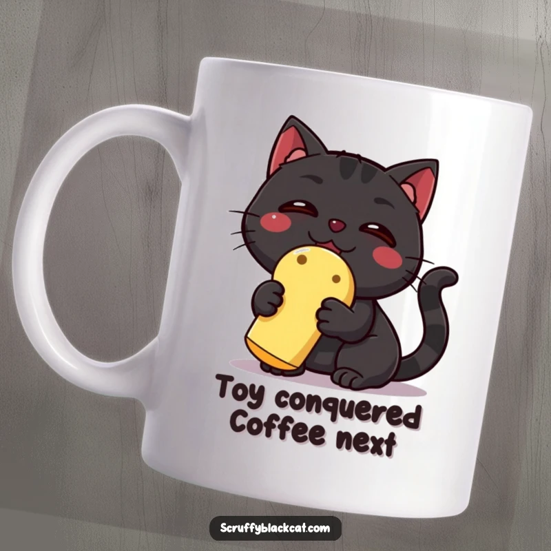 Funny Black Cat Mug: A triumphant black cat with wide eyes joyfully clutches a colorful squeaky toy, a hilarious symbol of pet victory.