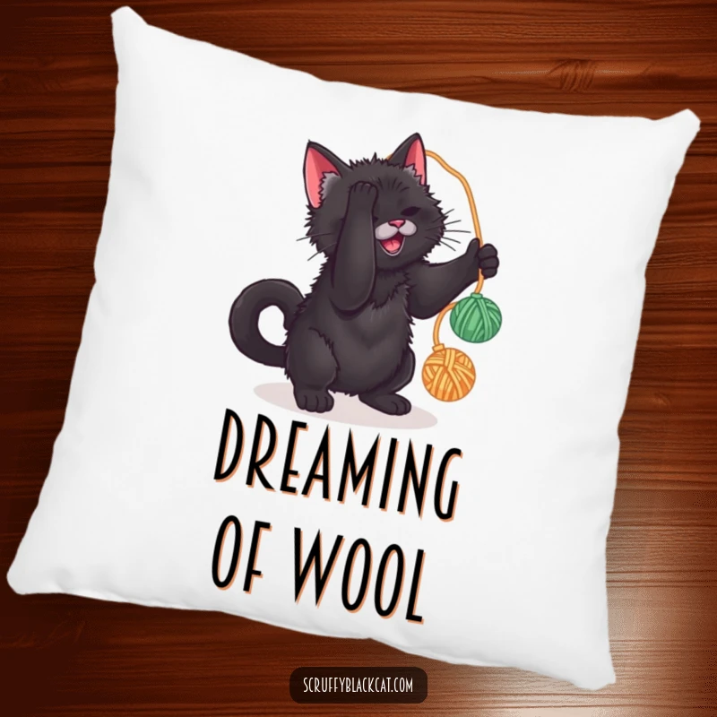 Funny pillow featuring a scruffy black cat batting at a yarn ball, offering cozy comfort and humorous feline play.