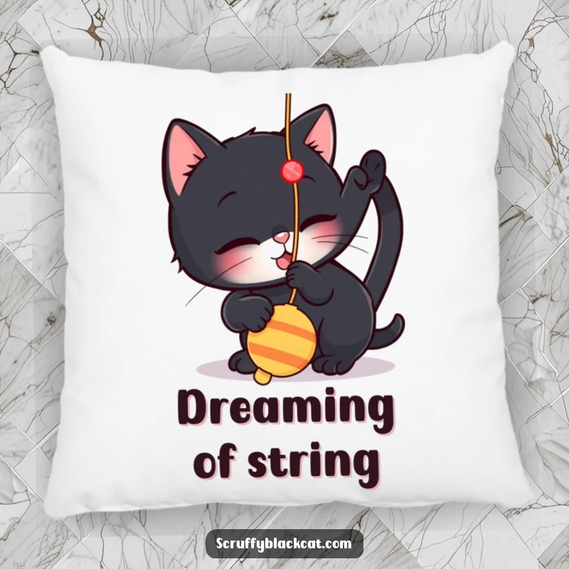 Funny pillow showcasing a small black cat playfully batting at a dangling string toy, providing comfort and a whimsical accent.