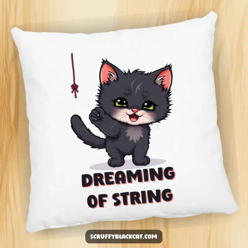 Funny decorative pillow featuring a scruffy black kitten gleefully playing with a dangling string, offering cozy charm.
