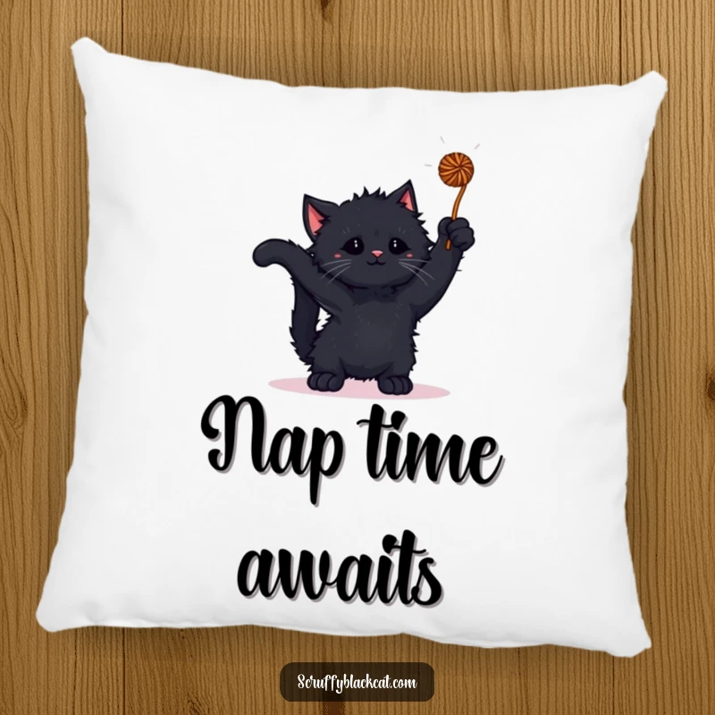 Funny kitten pillow with a scruffy black kitten playfully batting at a yarn ball, offering soft comfort.