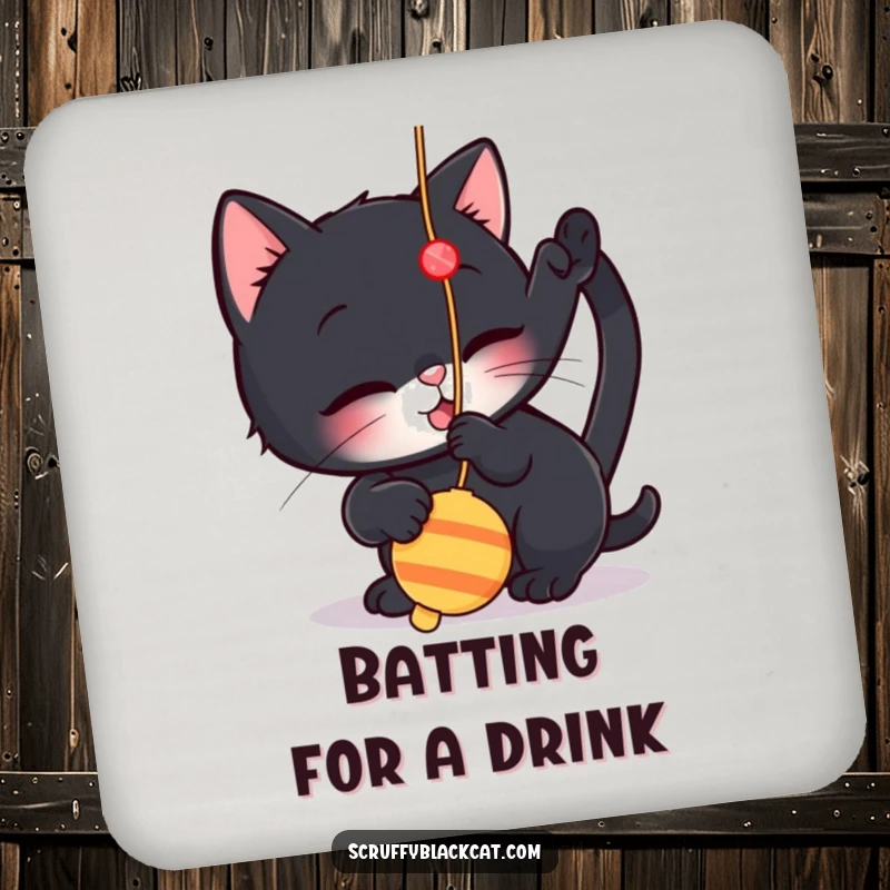 Funny drink coaster with a cat illustration playfully batting at a dangling string toy, protecting surfaces with feline humor.