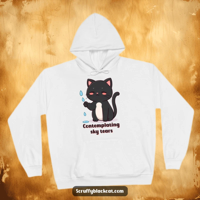 Funny Cat Hoodie with a black cat sitting upright, batting playfully at a falling raindrop, offering comfort and whimsical humor, a great funny gift.