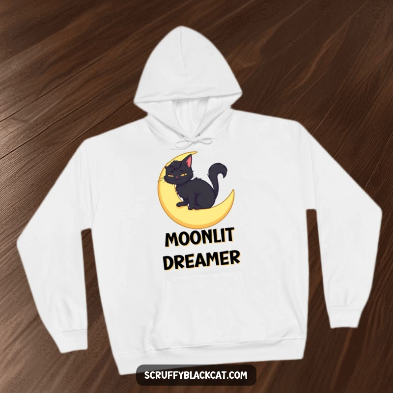 Funny hoodie design featuring a scruffy black cat sitting peacefully on a crescent moon, with a joyful, contented smile.
