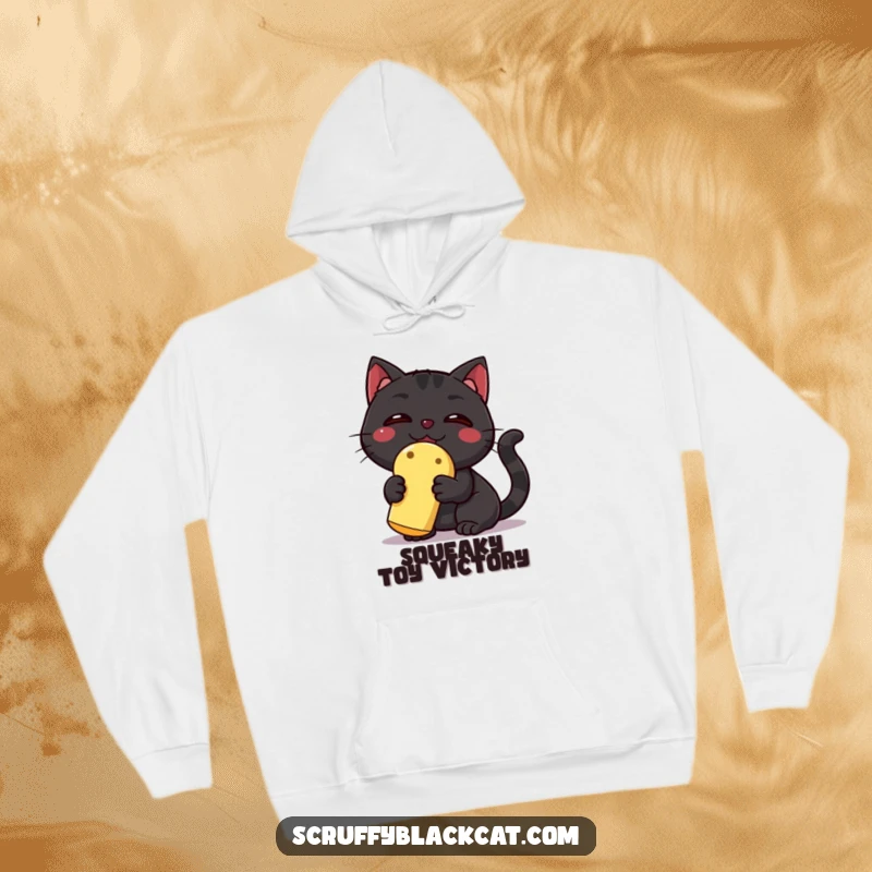 Funny Black Cat Hoodie: A triumphant black cat holds a squeaky toy high, a humorous depiction of feline achievement and playful pride.