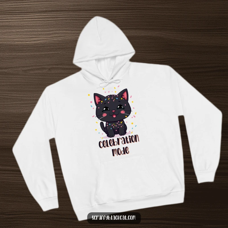 Funny hoodie: A black cat's silly grin peaks through a shower of vibrant party confetti.