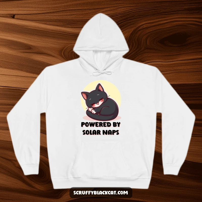 Funny black cat hoodie showing a cat curled up contentedly in a sunbeam, perfect for cozy relaxation.