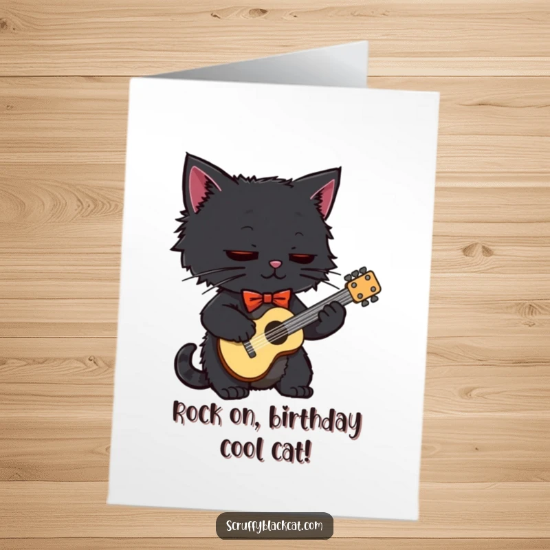 Funny Free Printable Birthday Card: Dapper black cat in a bow tie strumming a tiny guitar with musical notes floating.
