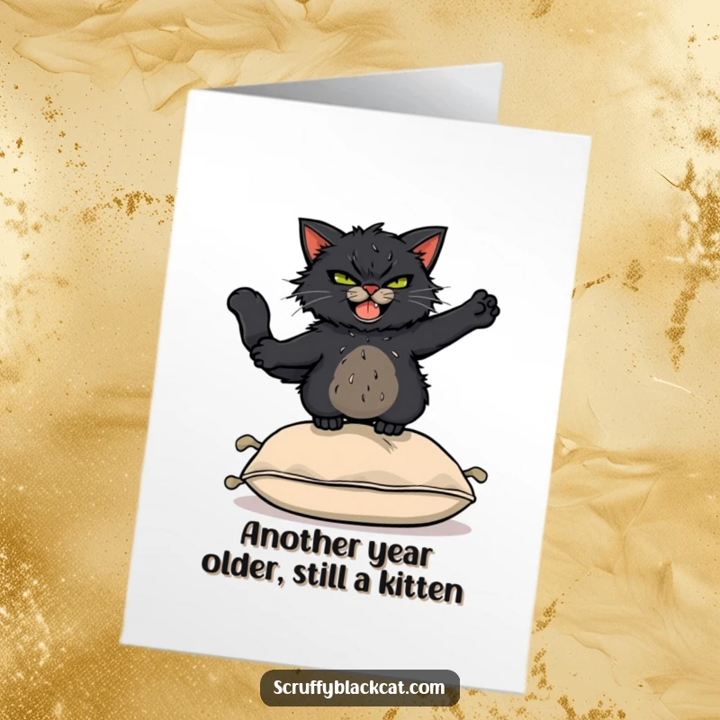 Funny Free Printable Birthday Card: Scruffy black cat grinning, mid-air leap over a cushion, pure mischief.