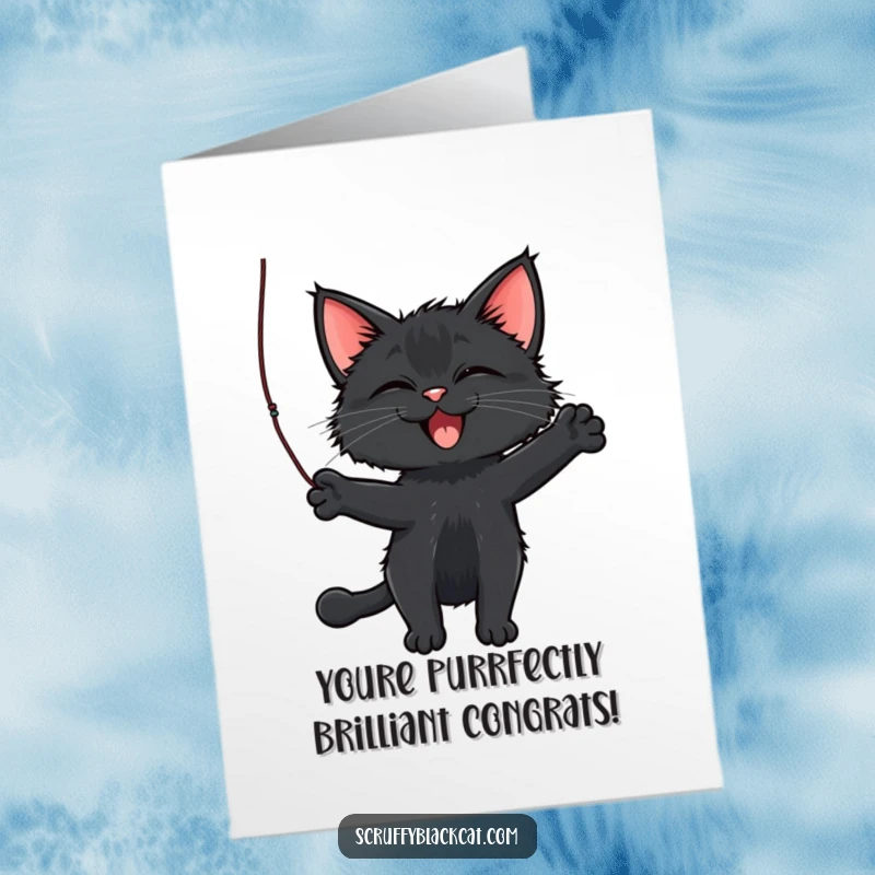 Funny Free Printable Congratulations Card showing a scruffy black cat joyfully attacking a dangling string.