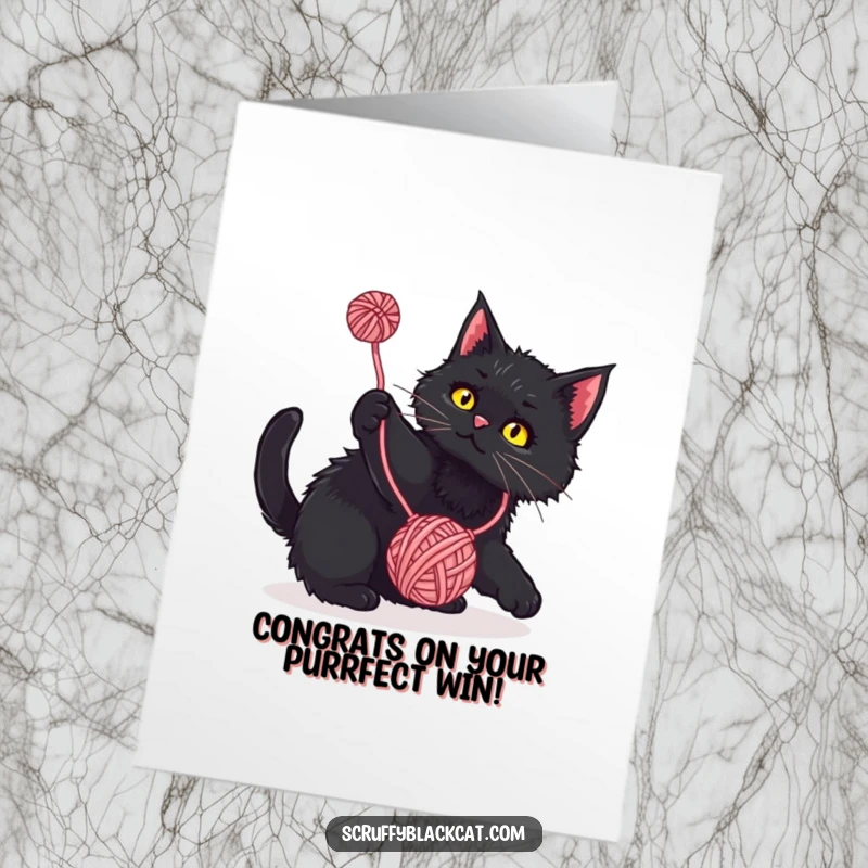 Funny Free Printable Congrats Card: A scruffy black cat gleefully pouncing and batting at a freely dangling ball of yarn.