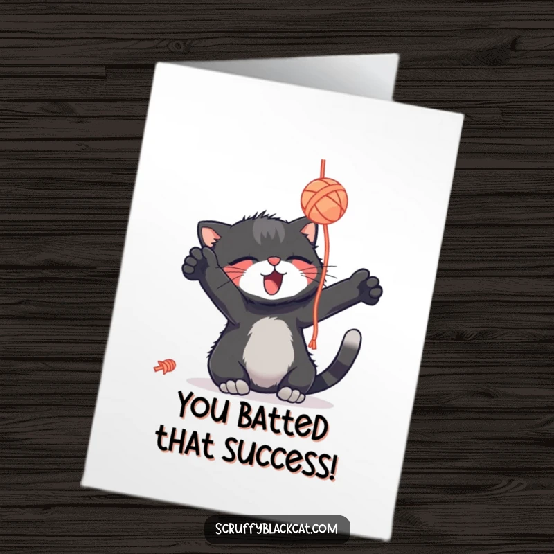 Funny free printable congratulations card: a delightful black cat plays with a yarn ball, celebrating a victory with joy.