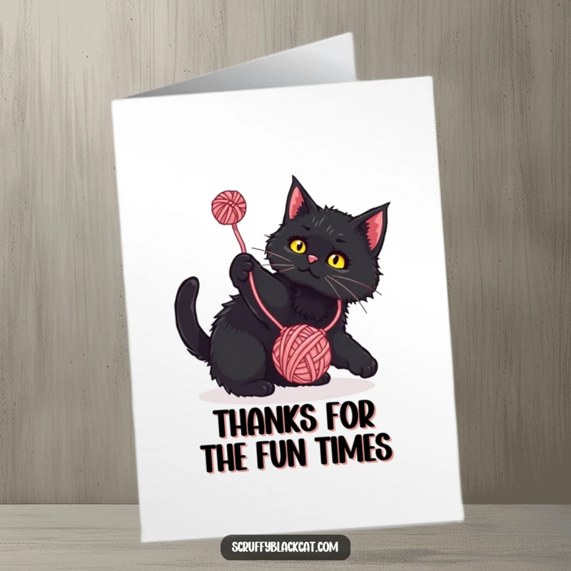 Funny Free Printable Thank You Card: A scruffy black cat in mid-play, batting enthusiastically at a swinging yarn ball.