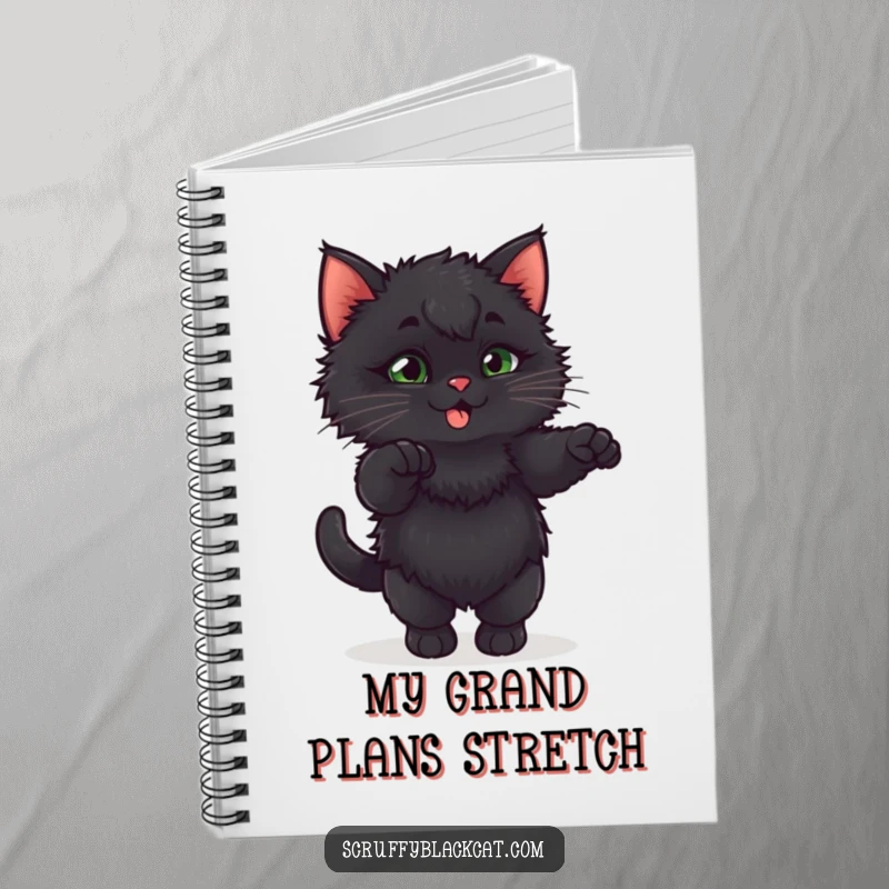 Funny fluffy black kitten in an exaggerated, playful stretch on the cover of a cute notebook.