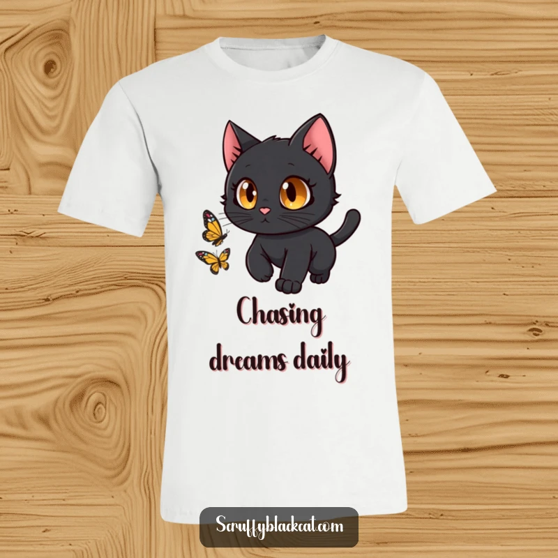 Funny black cat with wide, curious eyes playfully chasing a butterfly on a comfortable t-shirt.