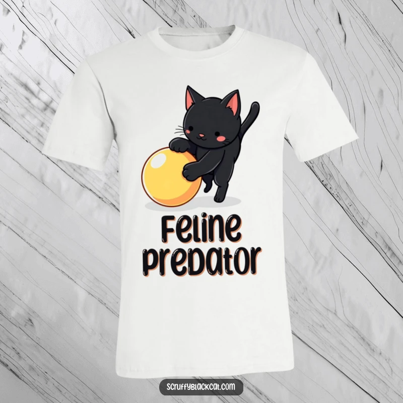 Funny cat t-shirt with a black cat in a playful pounce over a bright, bouncy ball, capturing dynamic action.
