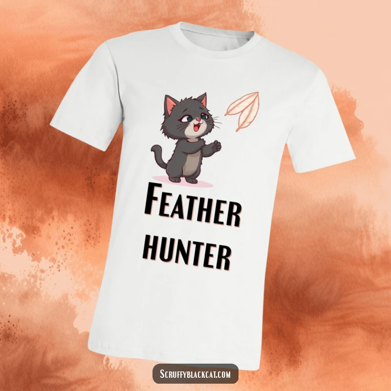 Funny t-shirt depicting a scruffy black cat playfully swatting at a bouncy feather on a string.