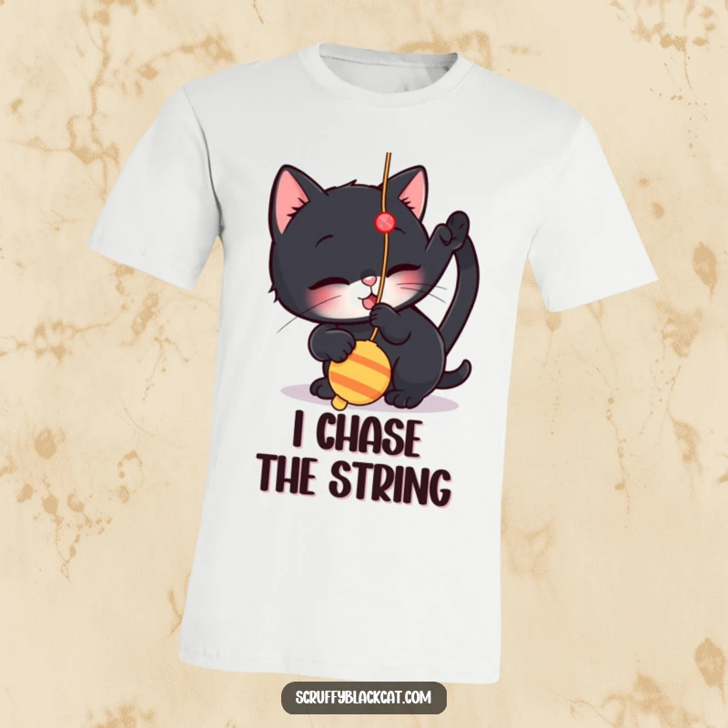 Funny t-shirt showing a small black cat playfully engaged with a dangling string toy, perfect for cat enthusiasts.