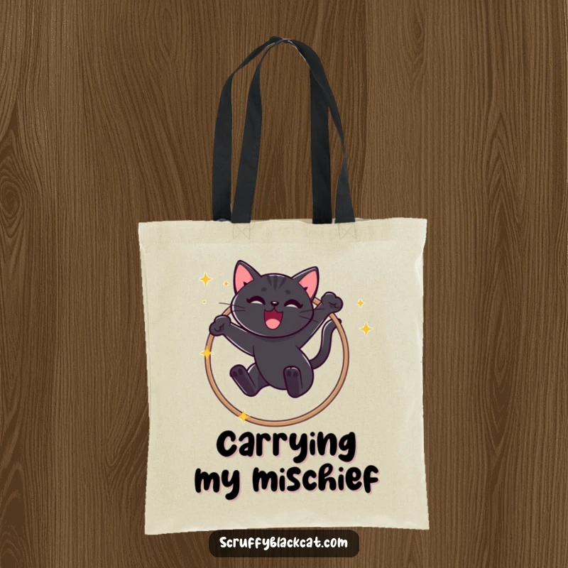 Funny Black Cat Tote Bag: Stylish carry-all with a mischievous cat mid-air, jumping through a sparkly hoop triumphantly.