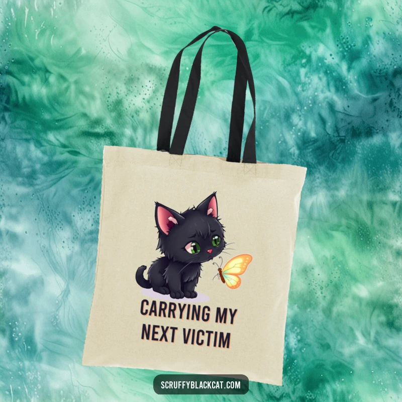 Funny tote bag featuring a scruffy black cat intently stalking a beautiful, shimmering butterfly, ideal for carrying daily items.