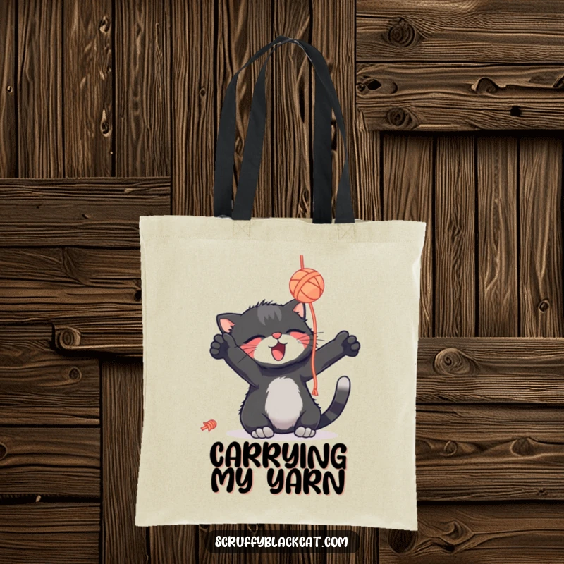 Funny scruffy black cat tote bag, batting a yarn ball with delight, a practical and humorous carry-all.